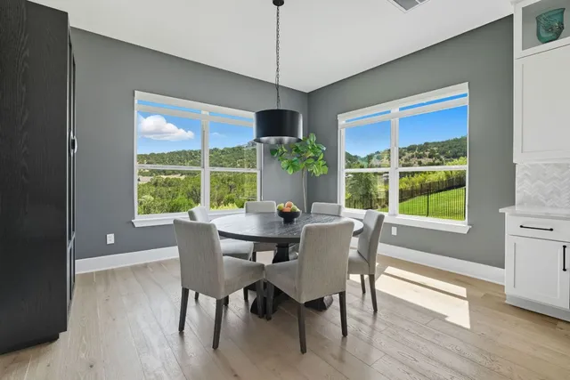 a dining room with furniture window wooden floor