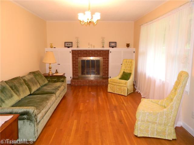 1614 Clingman Road Ronda, NC 28670 - Photo 2 of 12 Living Room. Hardwood floors under carpet in the living room.