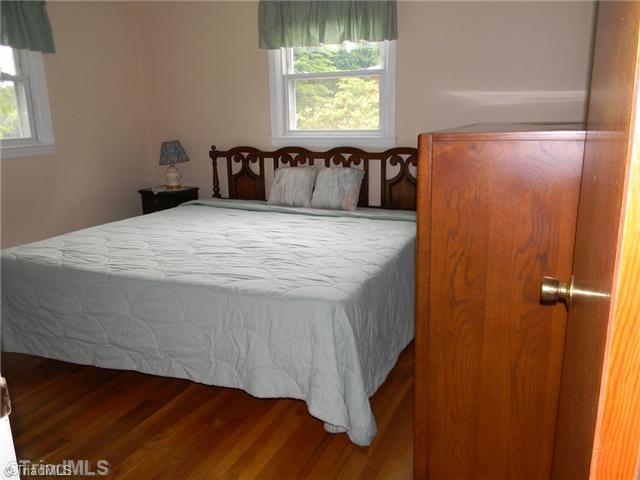 1614 Clingman Road Ronda, NC 28670 - Photo 8 of 12 1st Bedroom. There are hardwood floors in the bedrooms.