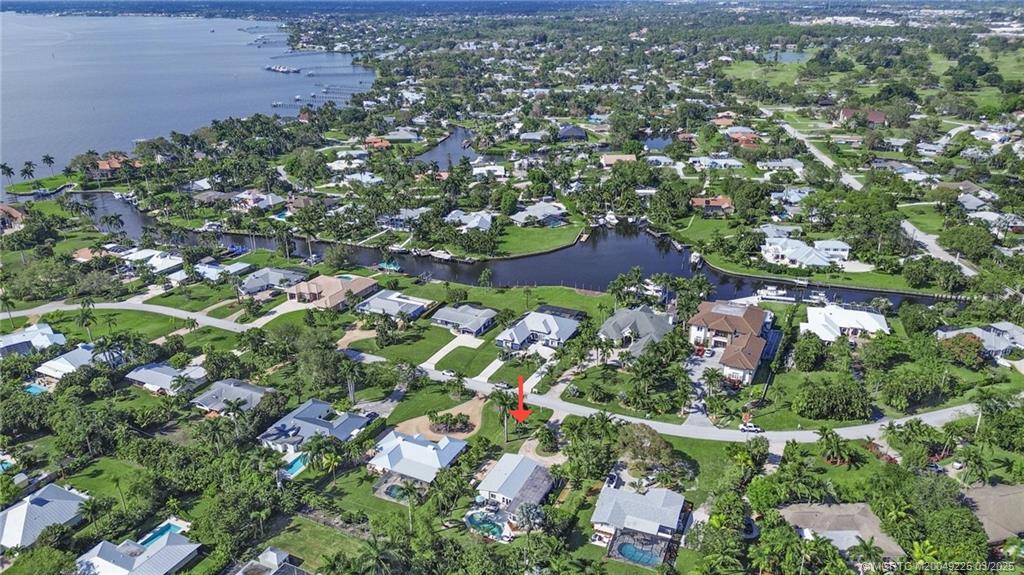 2325 Northwest Fork Road Stuart, FL 34994 - Photo 3 of 27 an aerial view of residential houses with outdoor space and trees
