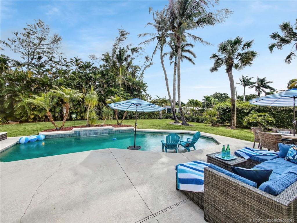 2325 Northwest Fork Road Stuart, FL 34994 - Photo 4 of 27 a view of swimming pool with lawn chairs and a yard