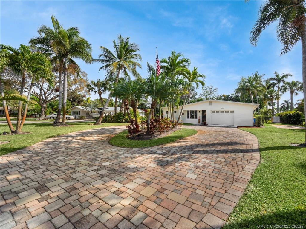 2325 Northwest Fork Road Stuart, FL 34994 - Photo 6 of 27 a view of a yard with palm trees