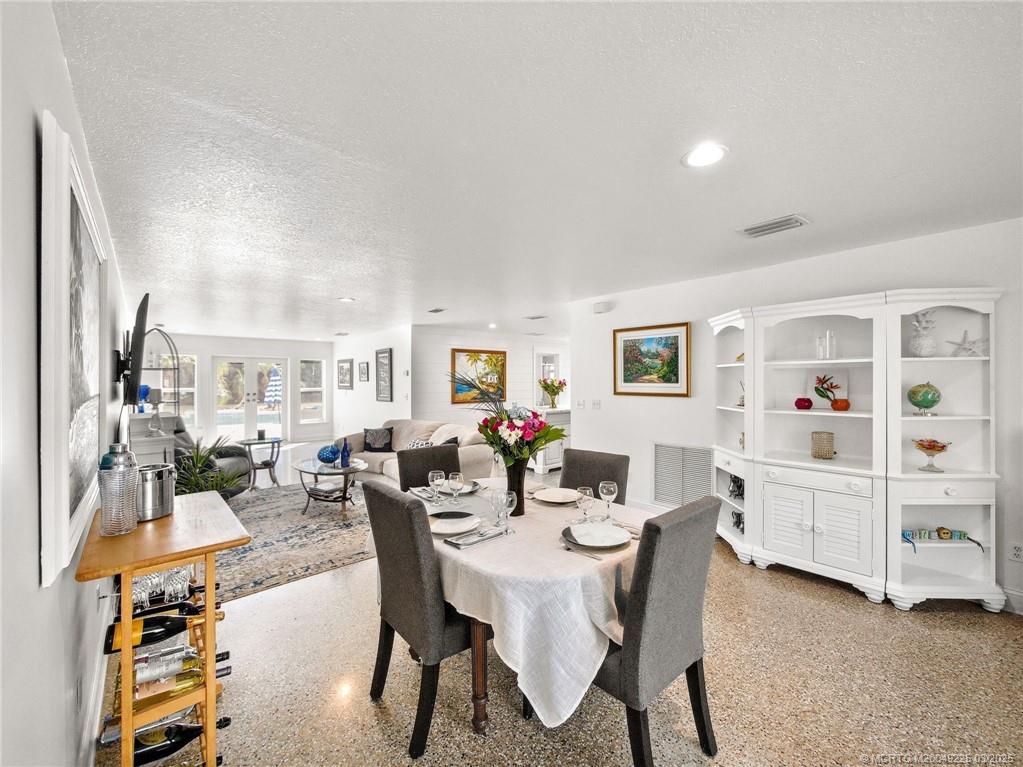 2325 Northwest Fork Road Stuart, FL 34994 - Photo 10 of 27 a view of a dining room with furniture and a livingroom