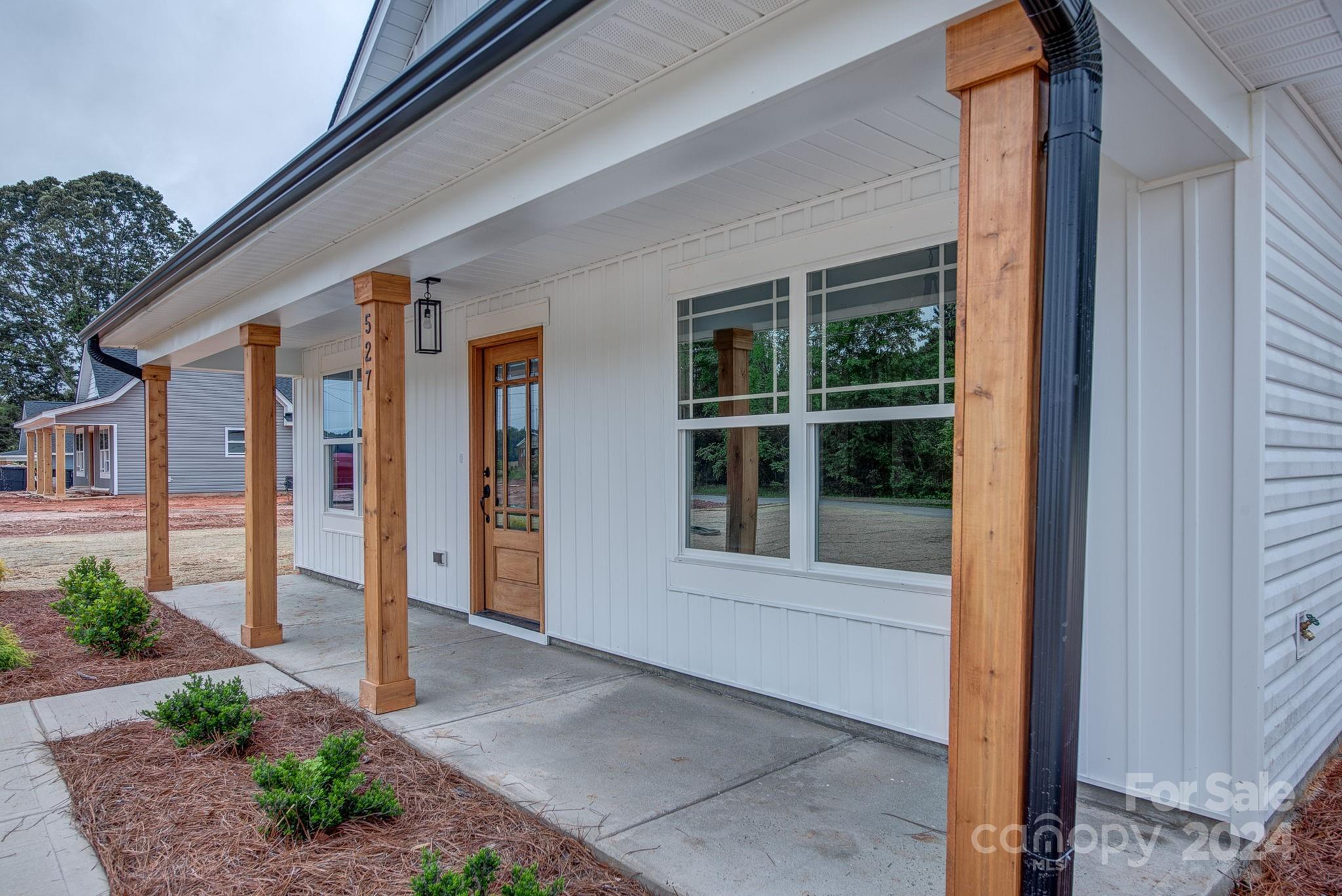 527 Blacksnake Road Stanley, NC 28164 - Photo 3 of 22 a front view of a house with a porch