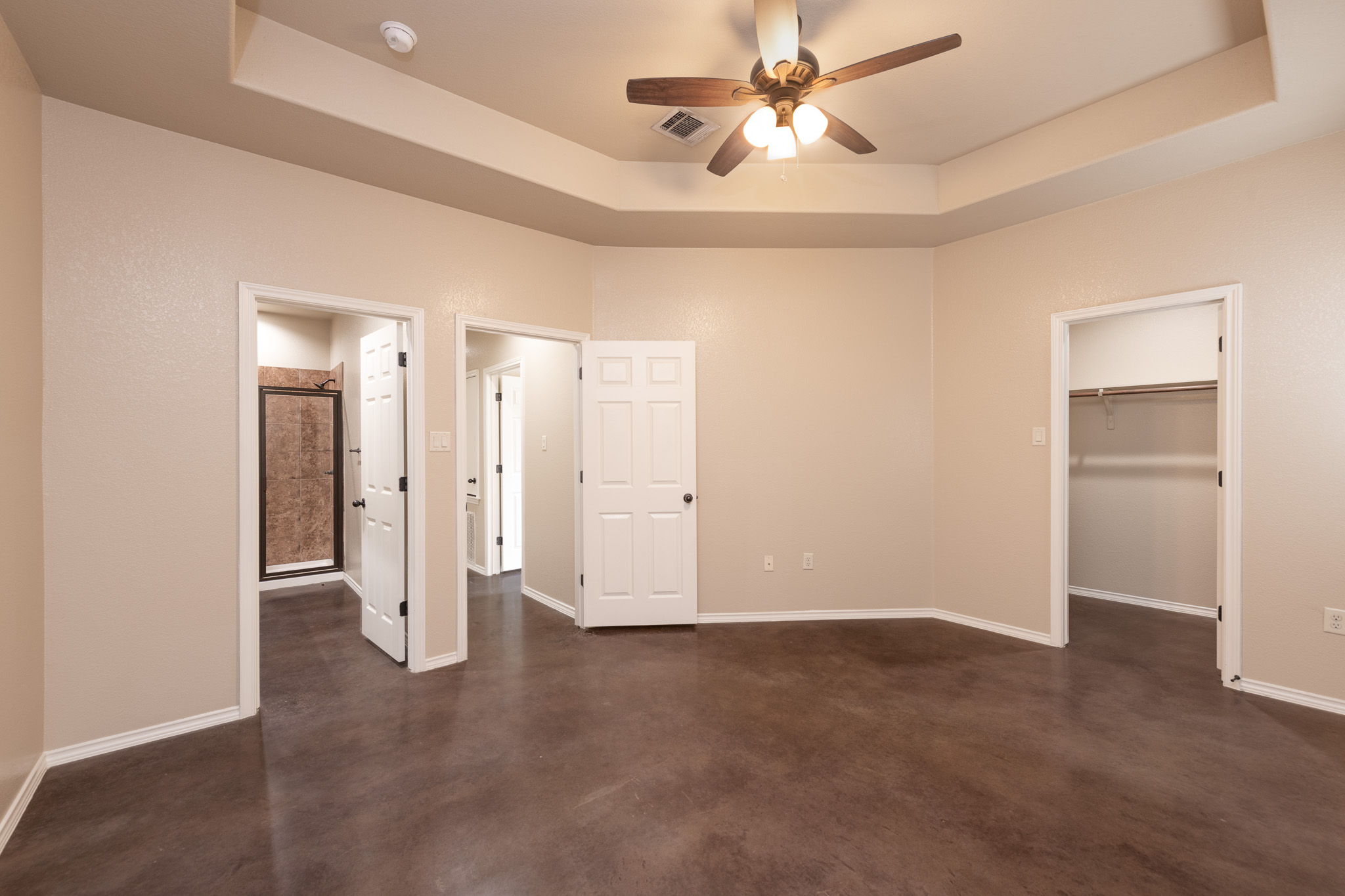 448 Jack Rabbit Lane, Unit A Buda, TX 78610 - Photo 14 of 19 a view of an empty room with a ceiling fan