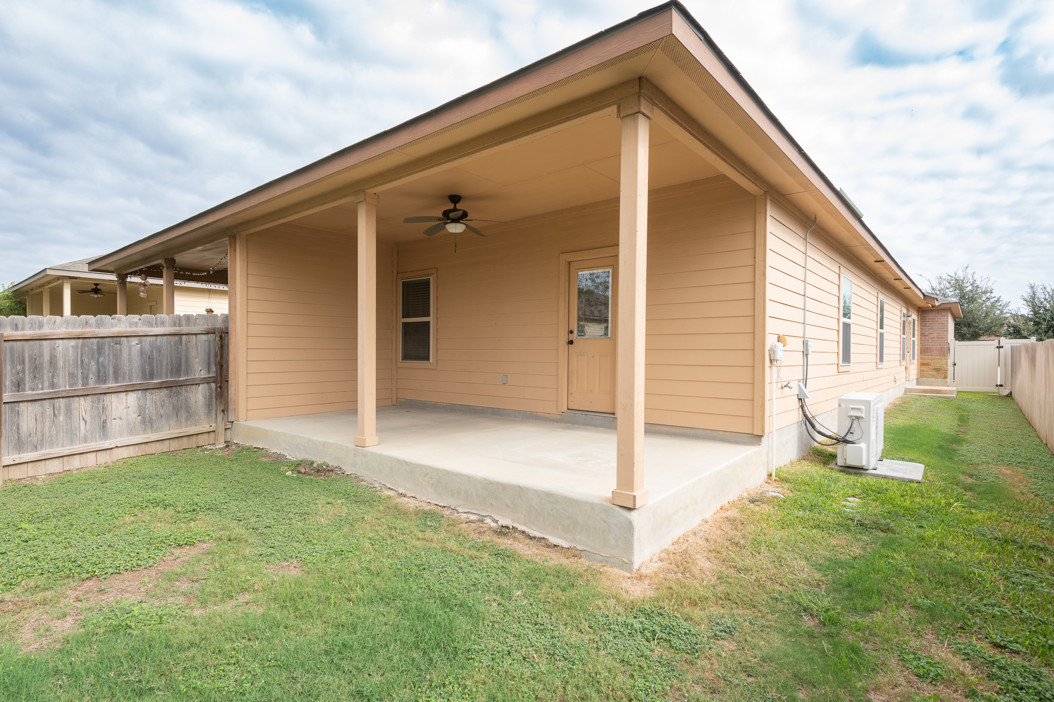 448 Jack Rabbit Lane, Unit A Buda, TX 78610 - Photo 16 of 19 a backyard of a house with seating space