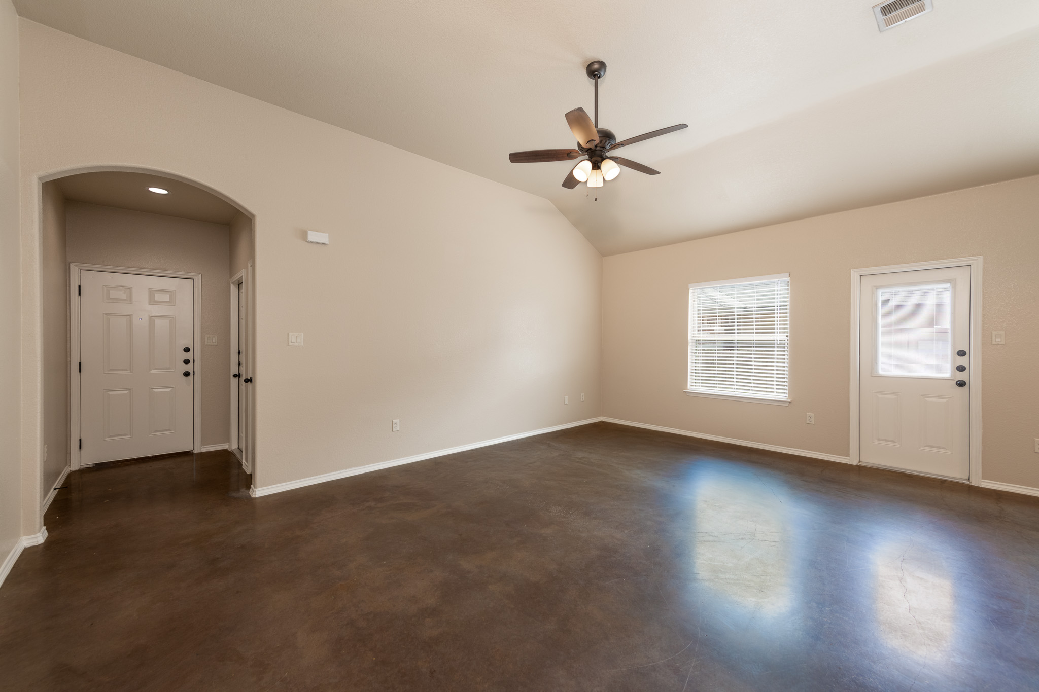 448 Jack Rabbit Lane, Unit A Buda, TX 78610 - Photo 5 of 19 an empty room with wooden floor fan and windows