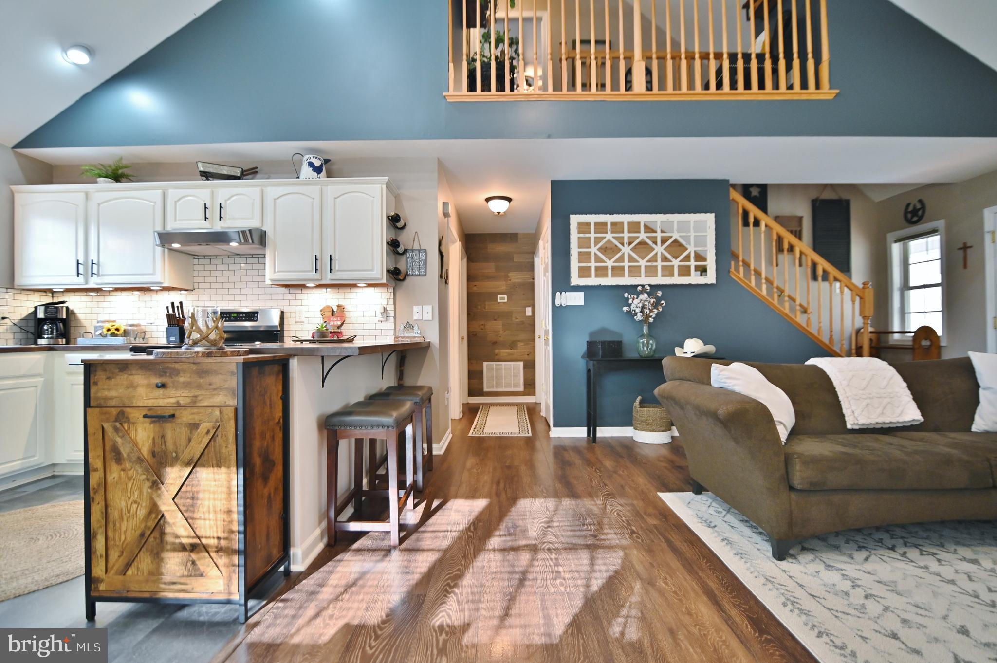 36 Pine Way Mount Jackson, VA 22842 - Photo 21 of 49 a living room with stainless steel appliances furniture a rug and a kitchen