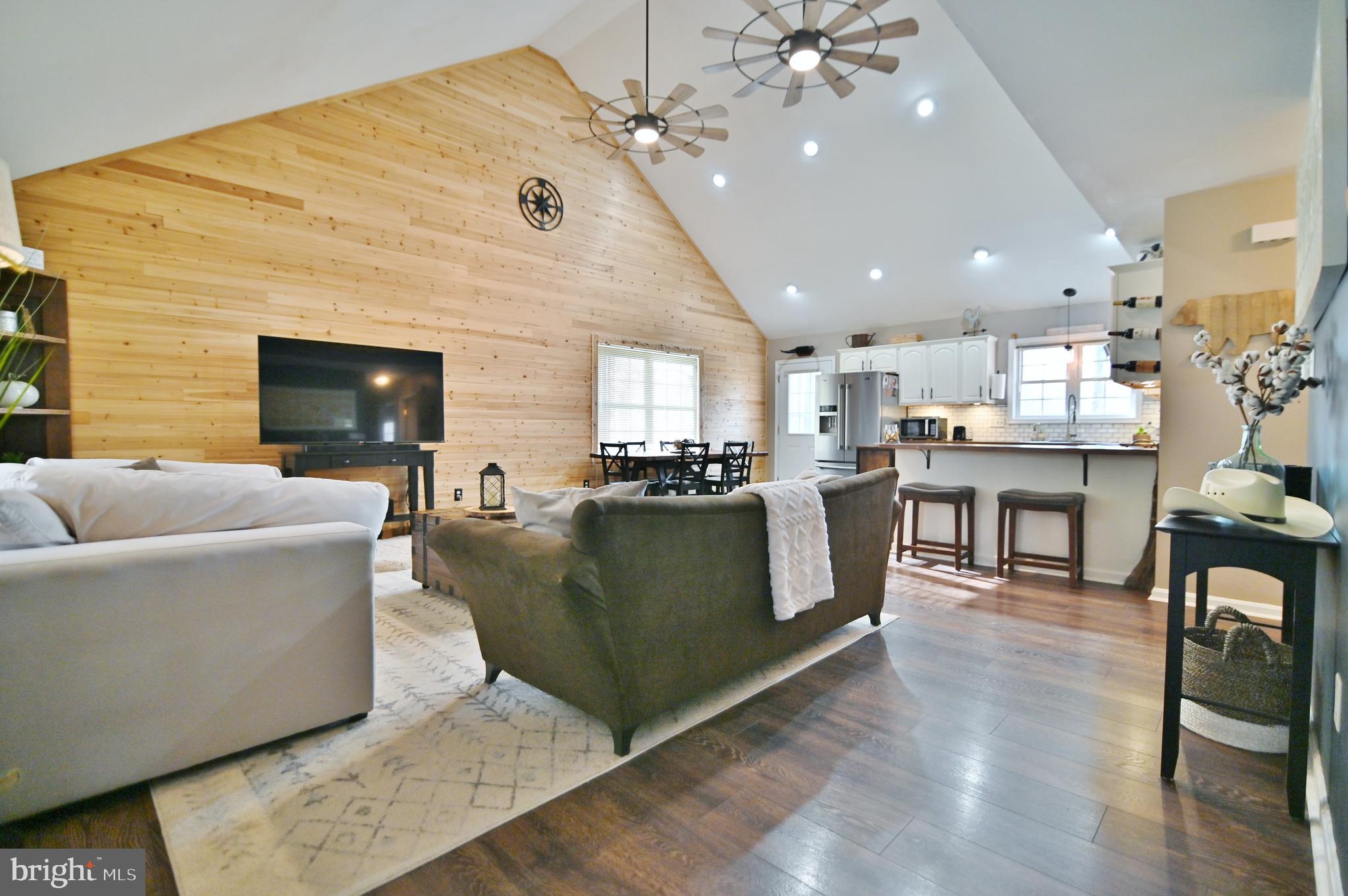 36 Pine Way Mount Jackson, VA 22842 - Photo 22 of 49 a living room with furniture and a chandelier