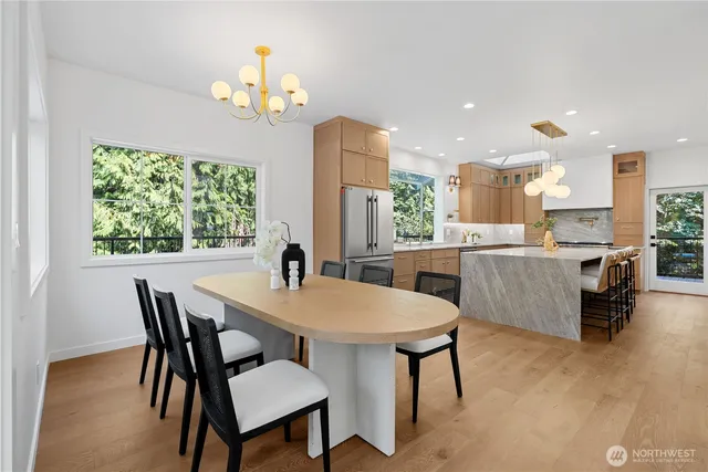 a view of a dining room with furniture window and wooden floor