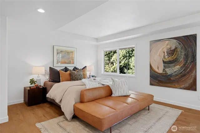 a bedroom with bed and a couch