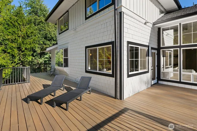 a view of a patio with wooden floor