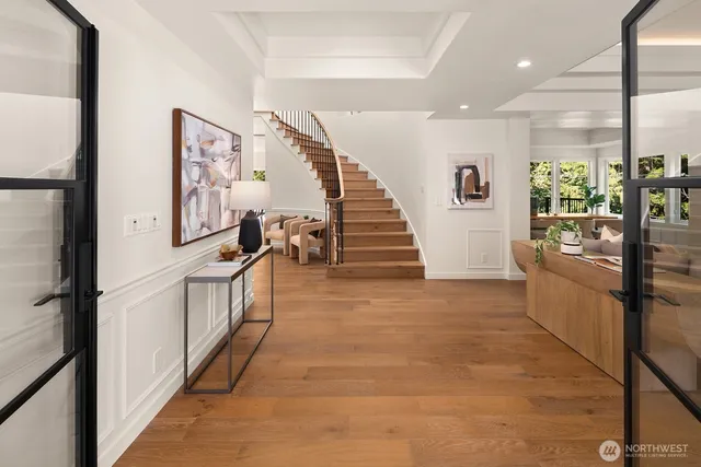 a view of entryway and hall with wooden floor