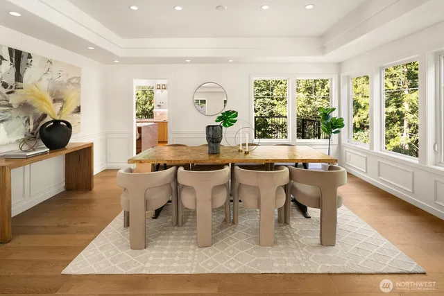 a dining room with furniture and wooden floor
