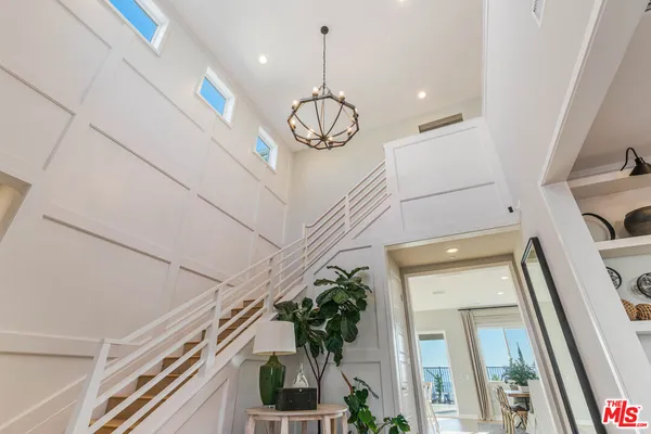 a very nice looking room with a large window and wooden floor