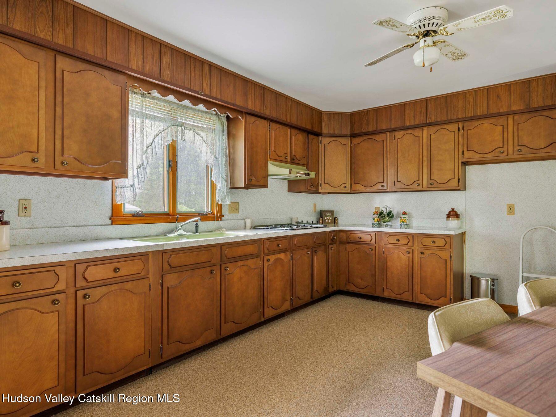 104 New Paltz Road Highland, NY 12528 - Photo 2 of 43 a kitchen with sink cabinets and window