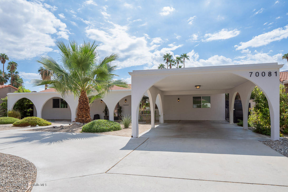 70081 Cobb Road Rancho Mirage, CA 92270 - Photo 2 of 17 a front view of a house with garden