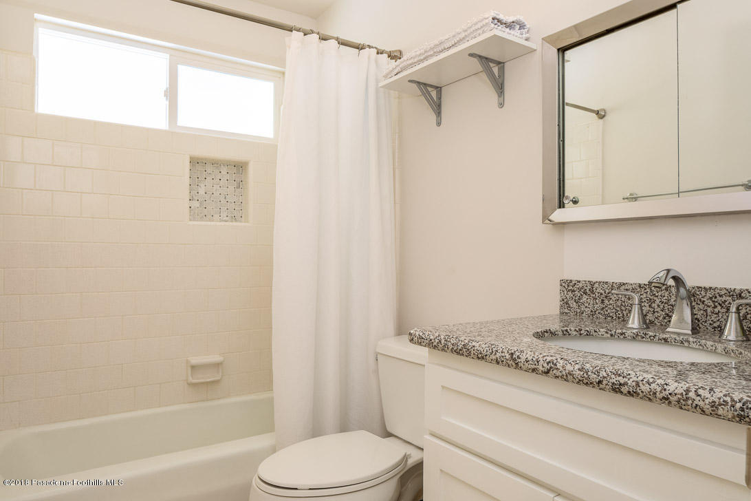 70081 Cobb Road Rancho Mirage, CA 92270 - Photo 9 of 17 a bathroom with a granite countertop sink toilet and shower
