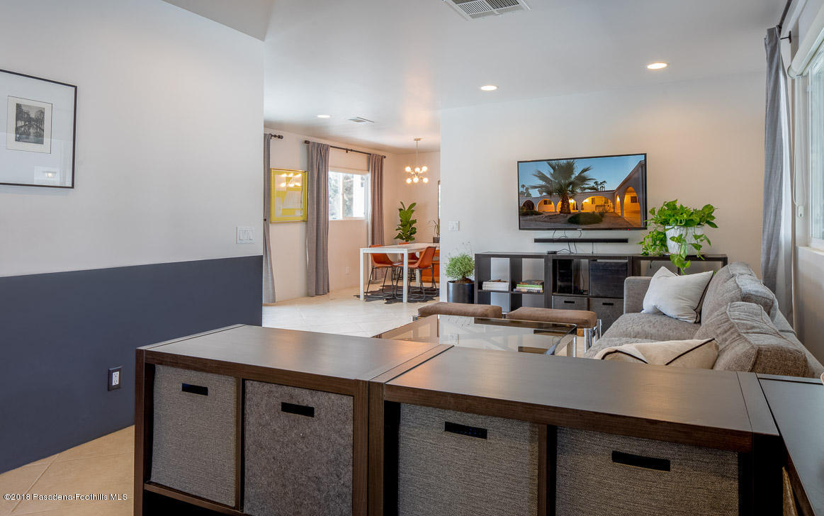 70081 Cobb Road Rancho Mirage, CA 92270 - Photo 10 of 17 a room with a table chairs and a flat screen tv