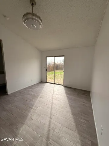 an empty room with a empty space and windows