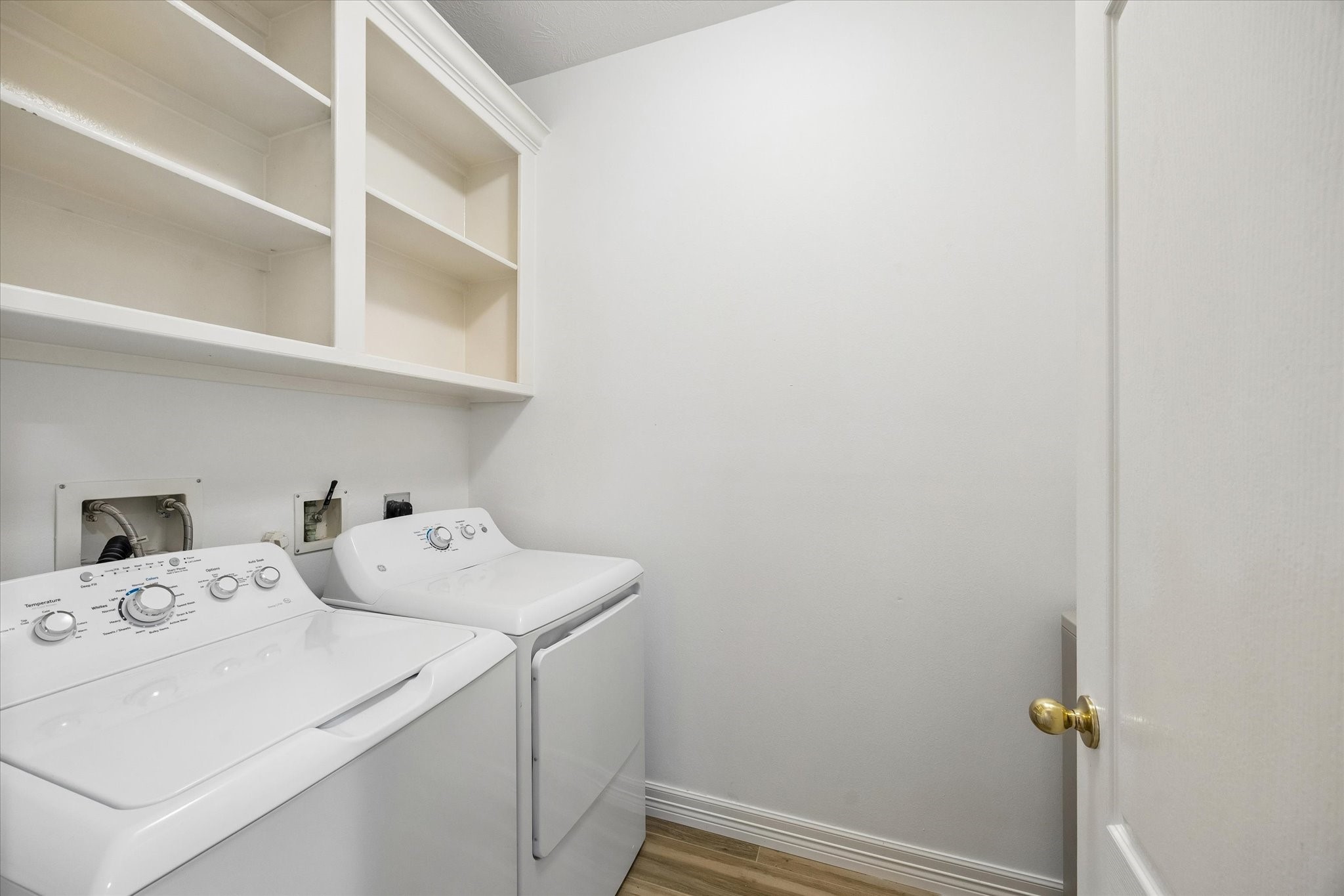 5306 Summerland Ridge Court Houston, TX 77041 - Photo 26 of 33 a utility room with dryer and washer