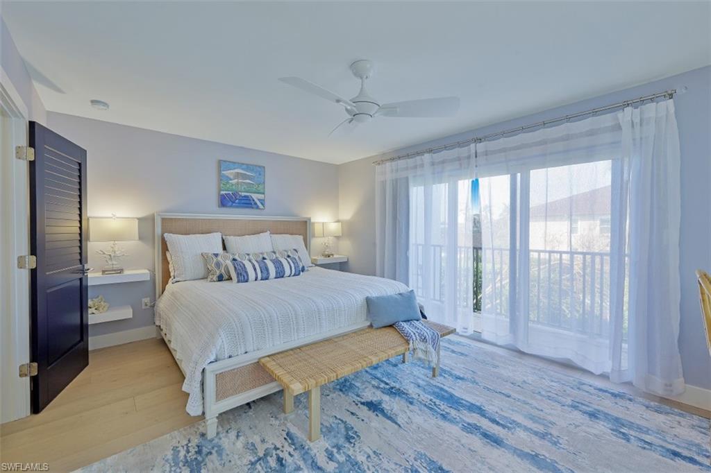 1060 6th Street South, Unit 1060 Naples, FL 34102 - Photo 11 of 31 a bedroom with a bed and a window