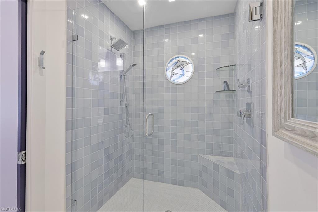 1060 6th Street South, Unit 1060 Naples, FL 34102 - Photo 13 of 31 a bathroom with a shower