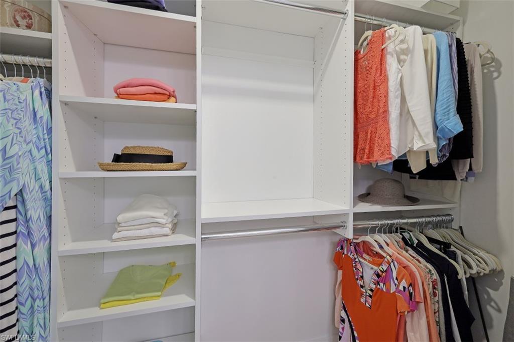 1060 6th Street South, Unit 1060 Naples, FL 34102 - Photo 14 of 31 a view of walk in closet with clothes and shoes