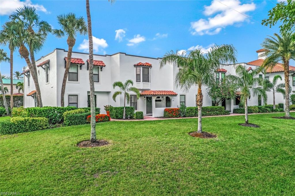 1060 6th Street South, Unit 1060 Naples, FL 34102 - Photo 18 of 31 a front view of house with a garden