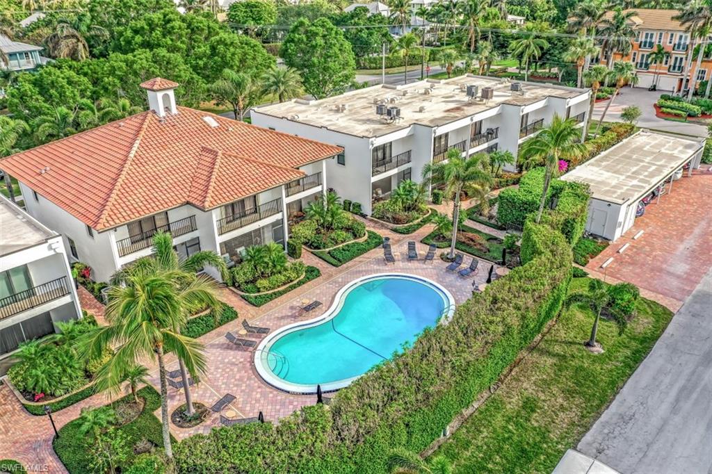 1060 6th Street South, Unit 1060 Naples, FL 34102 - Photo 19 of 31 an aerial view of a house with yard and patio