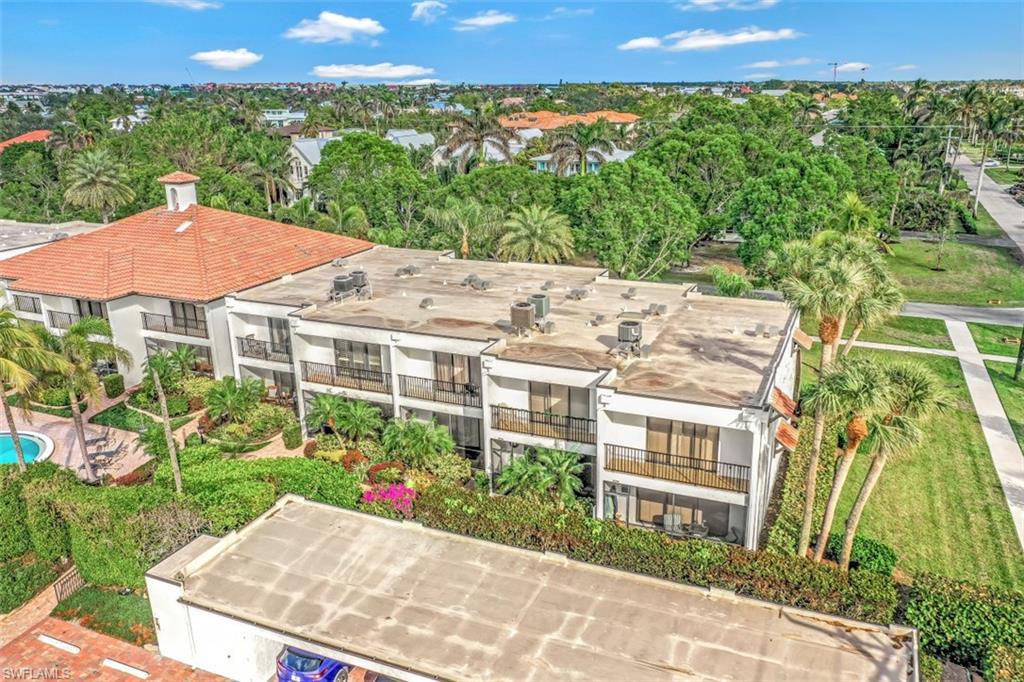 1060 6th Street South, Unit 1060 Naples, FL 34102 - Photo 22 of 31 a view of a garden with an outdoor space