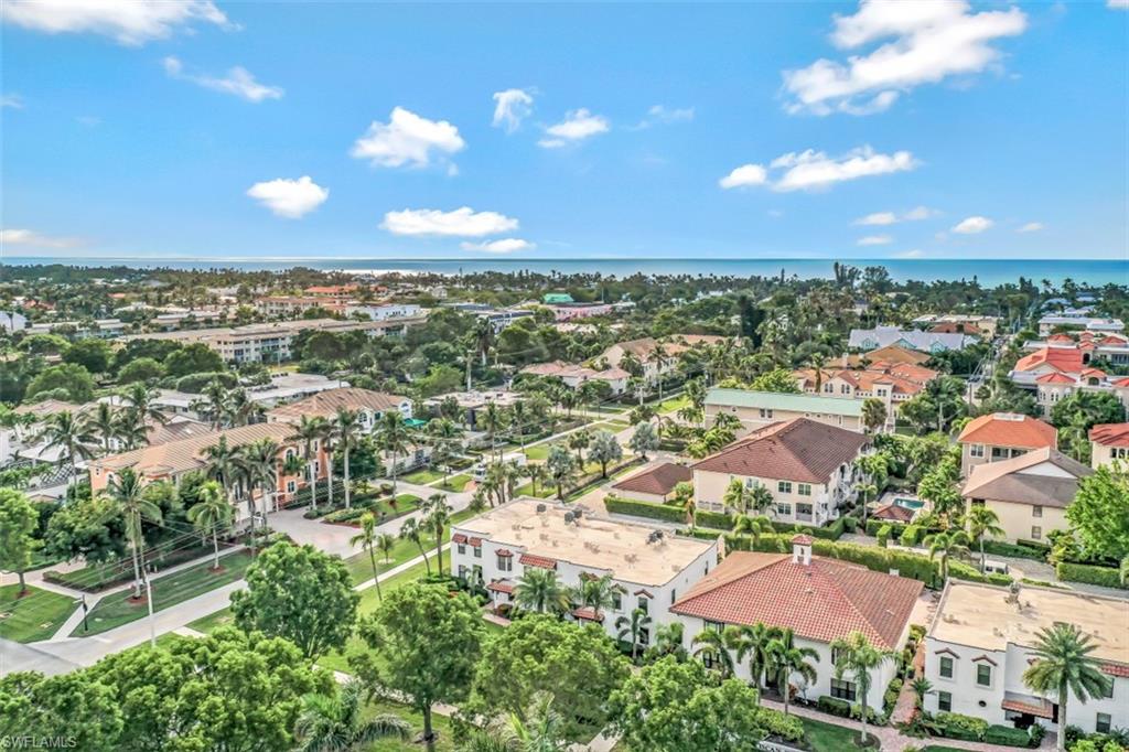 1060 6th Street South, Unit 1060 Naples, FL 34102 - Photo 25 of 31 an aerial view of residential houses with outdoor space and street view