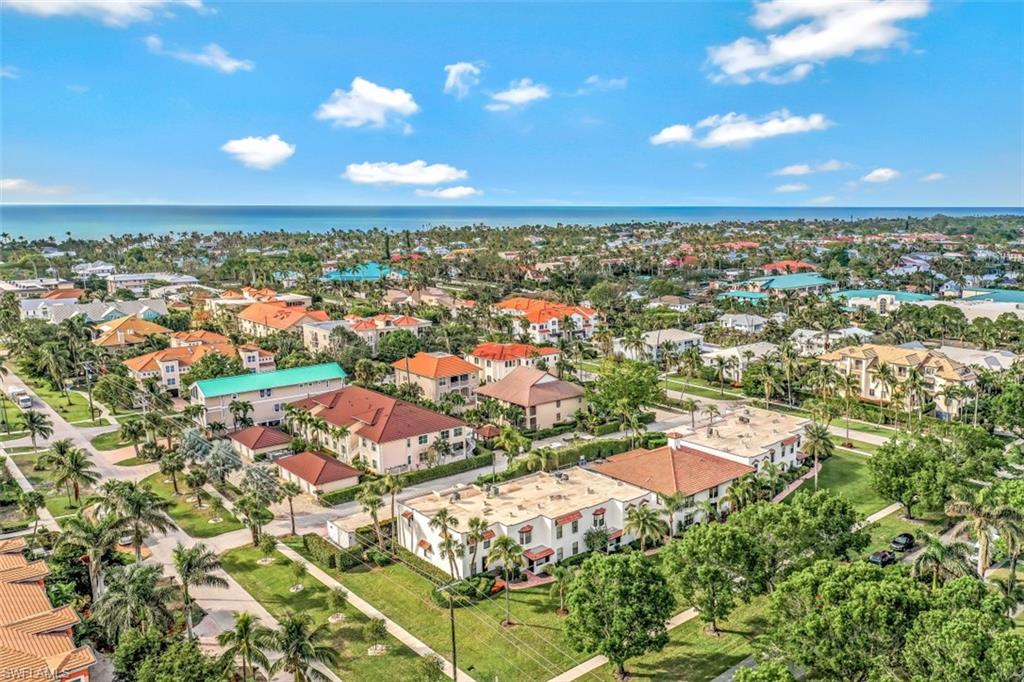 1060 6th Street South, Unit 1060 Naples, FL 34102 - Photo 26 of 31 an aerial view of residential houses with outdoor space