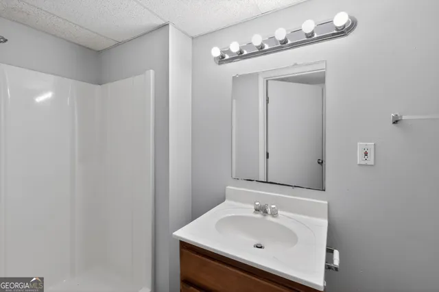 a bathroom with a sink and a mirror