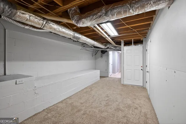 a house that has a tree in front of it