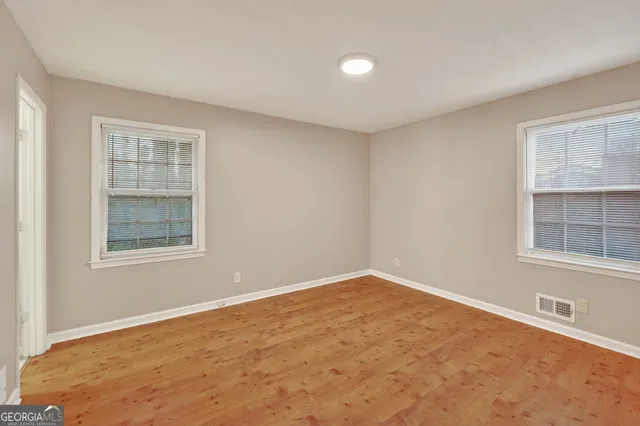 a view of an empty room with a window