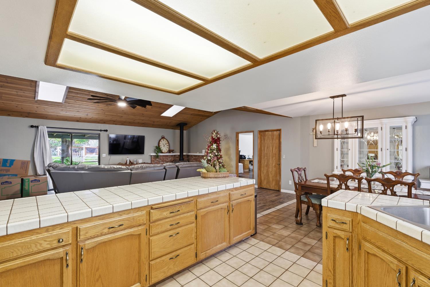 12126 Topper Road Madera, CA 93636 - Photo 14 of 40 a large white kitchen with a large window