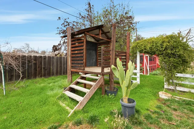 a swimming pool with some trees in the background
