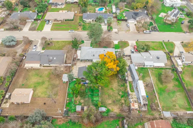 an aerial view of a house with outdoor space