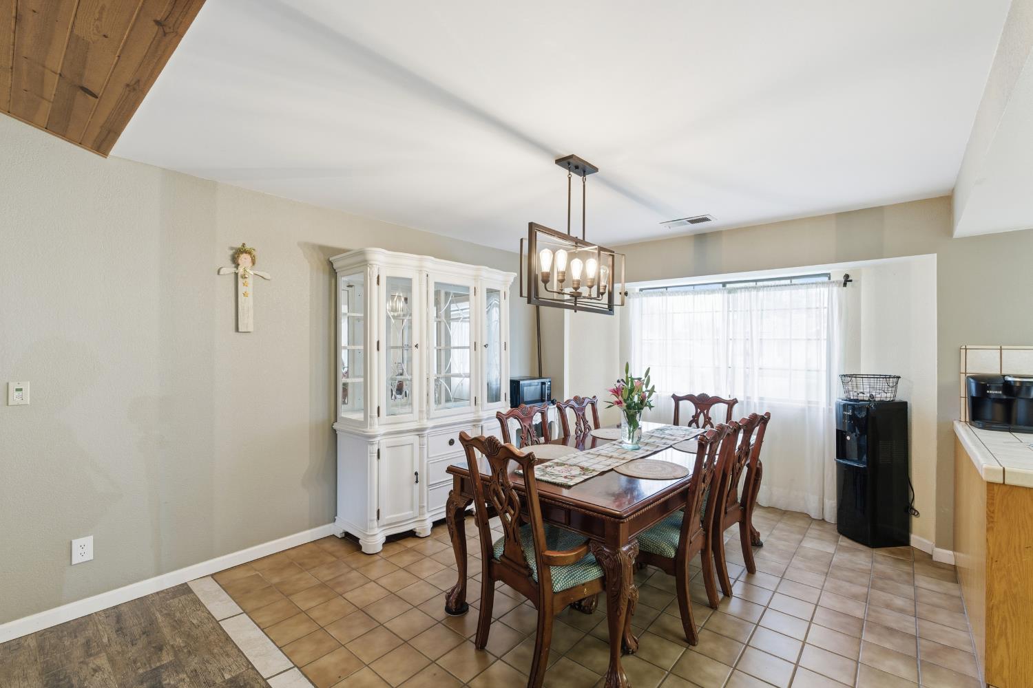 12126 Topper Road Madera, CA 93636 - Photo 8 of 40 a view of a dining room with furniture