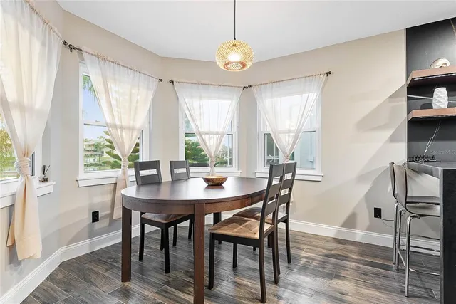 a bedroom with a bed couch and a window