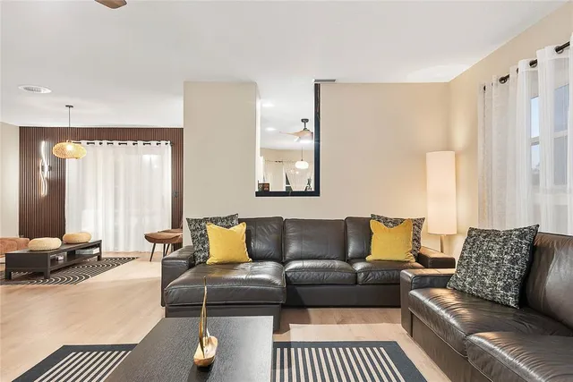 a spacious bathroom with a sink and a mirror