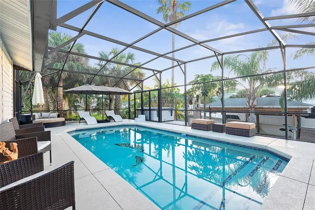 an aerial view of a house with a yard and garden