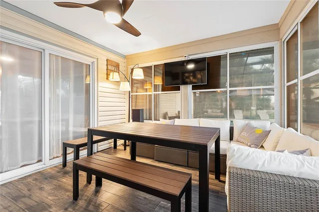 an aerial view of a city with lots of residential buildings and ocean view in back