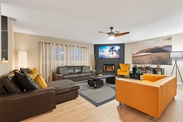 a kitchen with stainless steel appliances granite countertop a sink a stove and cabinets