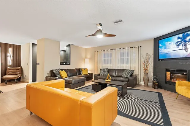 a kitchen with stainless steel appliances granite countertop a sink a stove and refrigerator