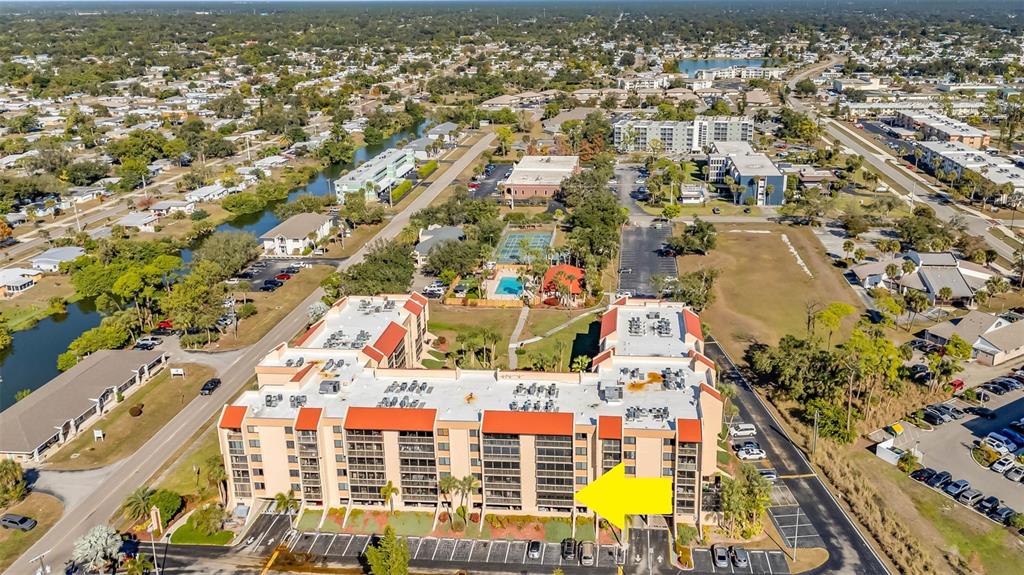 an aerial view of residential building and parking space