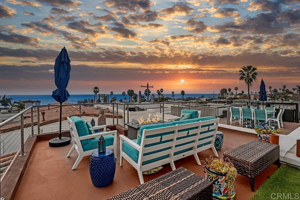 a view of a terrace with seating area and furniture