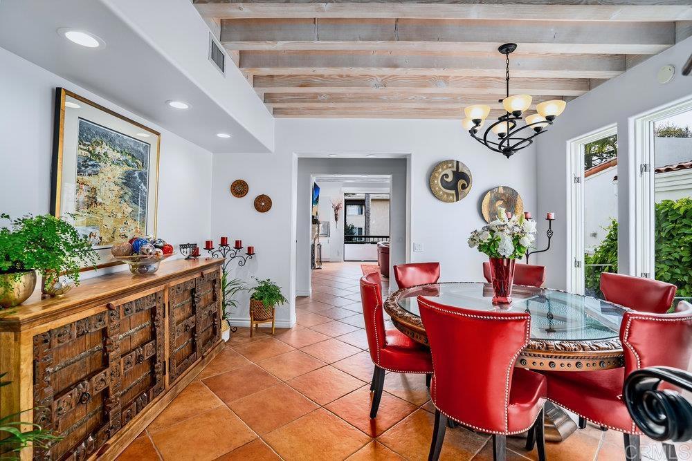 332 Gravilla Street La Jolla, CA 92037 - Photo 11 of 49 a large dining space with furniture window and wooden floor