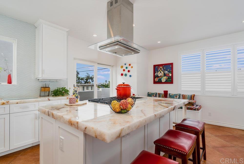 332 Gravilla Street La Jolla, CA 92037 - Photo 15 of 49 a kitchen with a sink cabinets and window